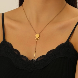 Y-shaped necklace with gold rose pendant and vertical bar tassel on female model