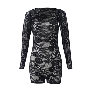 Detailed view of intricate floral lace texture on this black long sleeve bodysuit