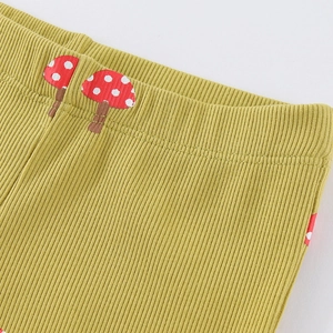 Ribbed knit leggings for toddler girls featuring mushroom patches in mustard yellow color