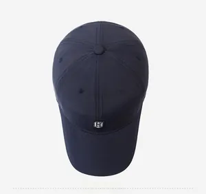 Top view of navy blue baseball cap featuring silver H emblem and six-panel stitch detail