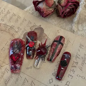Gothic dark style press-on nails with 3D red hearts, metal chains, and rose reliefs