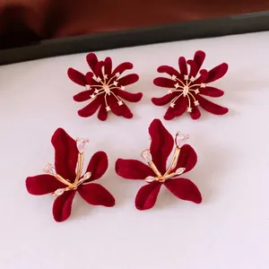 Elegant gold plated floral earrings with burgundy flocking and sparkling zircon accents