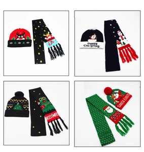 Detail view of colorful knitted Christmas hats and scarves set with festive patterns