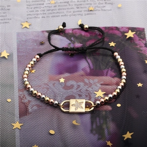 Adjustable black rope bracelet with tri-color metallic beads and zircon star charm