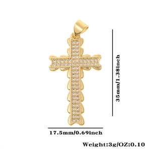 Detail view of a gold-plated copper cross pendant with cubic zirconia and dimensions
