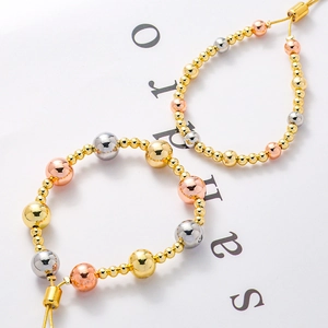 Adjustable tri-color copper bead bracelet for women featuring gold silver and rose gold tones