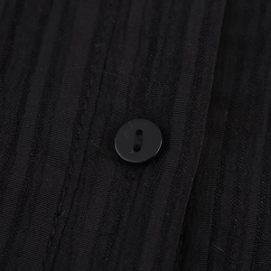 Robe sans manches en velours côtelé noir avec col à revers et texture à rayures fines
