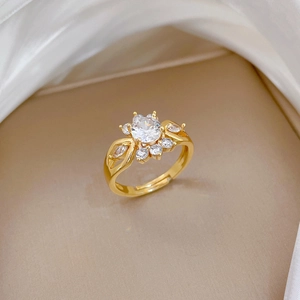 Adjustable gold plated ring featuring crown design with large round zircon and small stones