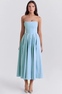 Detail of light blue strapless midi dress featuring pleated skirt and corset waist design