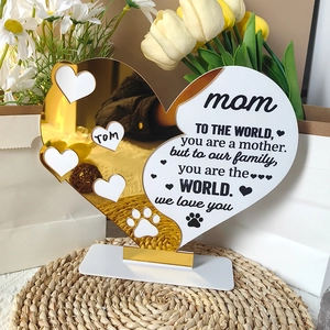 Detail of white and gold acrylic heart ornament for Mom with photo frame and base