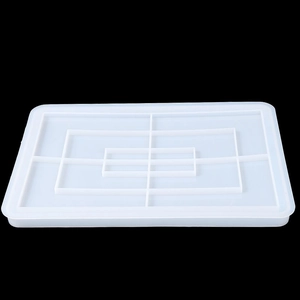 Detailed view of rectangular translucent silicone mold with multi-layer nested compartments