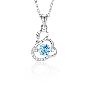 Macro view of S925 silver swan necklace with light blue zircon and detailed pave stones