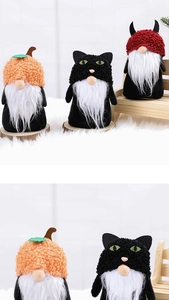 Detail shot of Halloween gnomes featuring pumpkin, black cat and devil designs in plush fabric