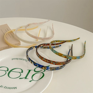 Elegant non-slip acetate headbands in six colors including amber and tortoise shell