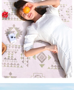 Detail of pink geometric picnic mat with high-quality printing and soft fabric texture