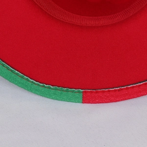 Close-up of red and green patchwork wool felt fedora showing detailed stitching and fabric