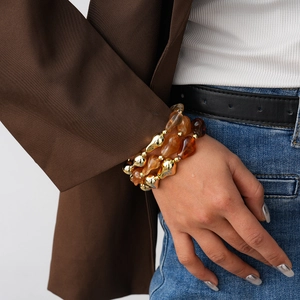 Three-piece stackable vintage beaded bracelet set with amber resin and gold metal beads