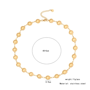 Detail showing 40+5cm chain length and 0.9cm golden bead size on stainless steel necklace