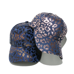 Women's baseball caps with metallic leopard print in navy and light blue denim