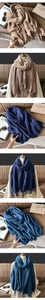 Detail of ribbed knit cashmere-like scarf with fringe in khaki and navy blue colors