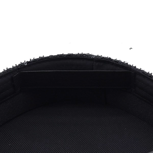 Detail view of the black sequined hat showing the mesh lining and elastic inner band