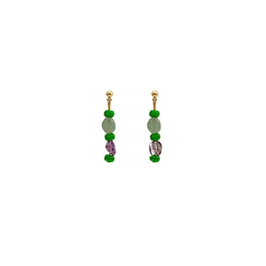 Detail of beaded earrings with green and purple stones on gold-plated metal hooks