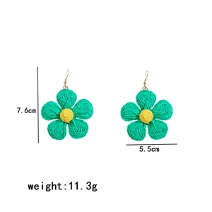 Detailed dimensions of handmade woven raffia flower earrings in green and yellow