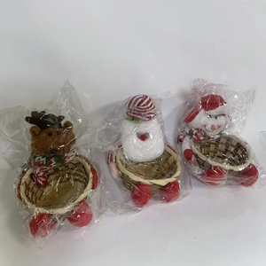 Close-up of bamboo Christmas candy baskets featuring reindeer and snowman plush designs