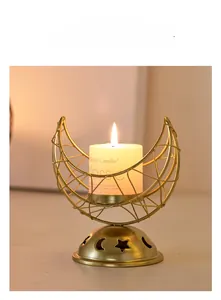 Detailed view of golden crescent moon metal incense burner with star and moon cutouts