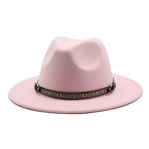 Detailed close-up of pink wool fedora with ethnic woven band and leather strap