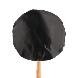 Detailed view of the smooth black satin fabric and elastic band on the sleep hair cap