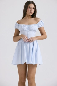 Detail of light blue puff sleeve dress with pleated design and button front