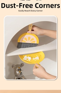 Detail view of mini lemon broom cleaning set sweeping curved shelf corners by hand