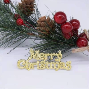 Christmas tree decoration with pine branches, red berries and golden Merry Christmas sign