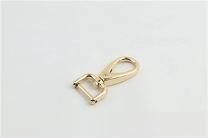 Close-up of light gold lobster swivel clasp with rotating D-ring for bags