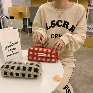 Detail of waffle fleece pencil case with checkerboard pattern and zipper closure