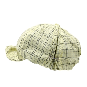 Plaid newsboy beret hat in light yellow with black check pattern and metal side buckle