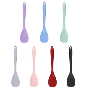 Seven-piece colorful silicone salad spoons set with hanging holes on white background