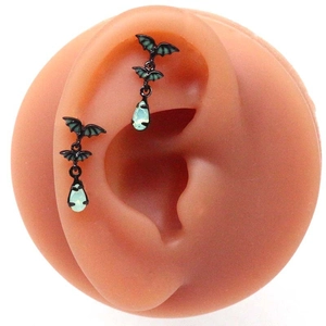 Gothic black bat wing earrings with light green waterdrop pendant on ear model