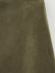 Macro shot of olive green suede fabric texture with refined matte finish for midi skirt