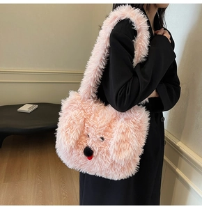 Close-up of fluffy pink plush puppy tote bag with cute 3D dog face and soft fur texture