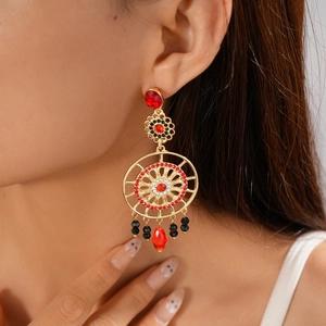 Bohemian gold flower earrings with red and black crystals and teardrop pendants