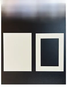 Detail of white mat board with rectangular window opening for picture frame mounting
