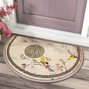 Semi-circle Chinese style entry mat with floral and bird patterns on wooden floor