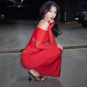 Detailed side view of a sexy red mesh off-the-shoulder long sleeve dress for women