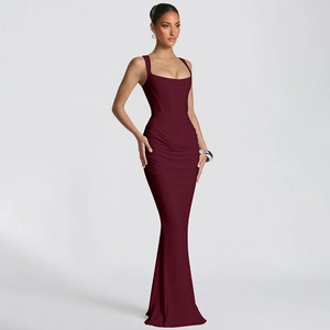 Detail view of burgundy ruched evening dress with boning and slim fit floor-length design