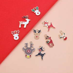 Detail of Christmas reindeer enamel metal charms with colorful rhinestone accents