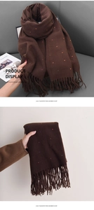 Detail of soft dark brown scarf with multi-color polka dots and tassel edges