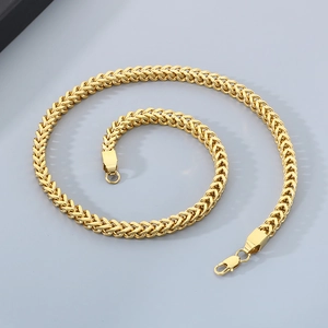 Close-up of gold-plated stainless steel dragon bone chain with fox-tail weaving detail