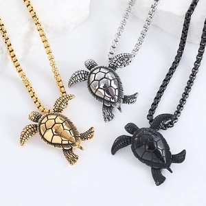 Stainless steel sea turtle pendant necklaces in gold, silver, and black finish on stone